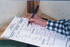 hand filling out a ballot