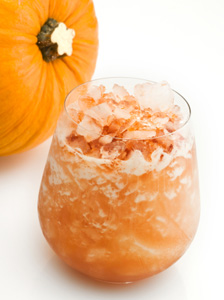 orange drink next to pumpkin